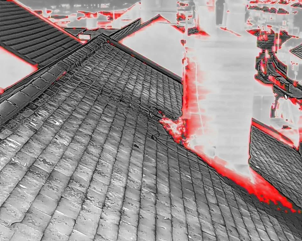Thermal drone image of a roof, with the chimney flashing highlighted
